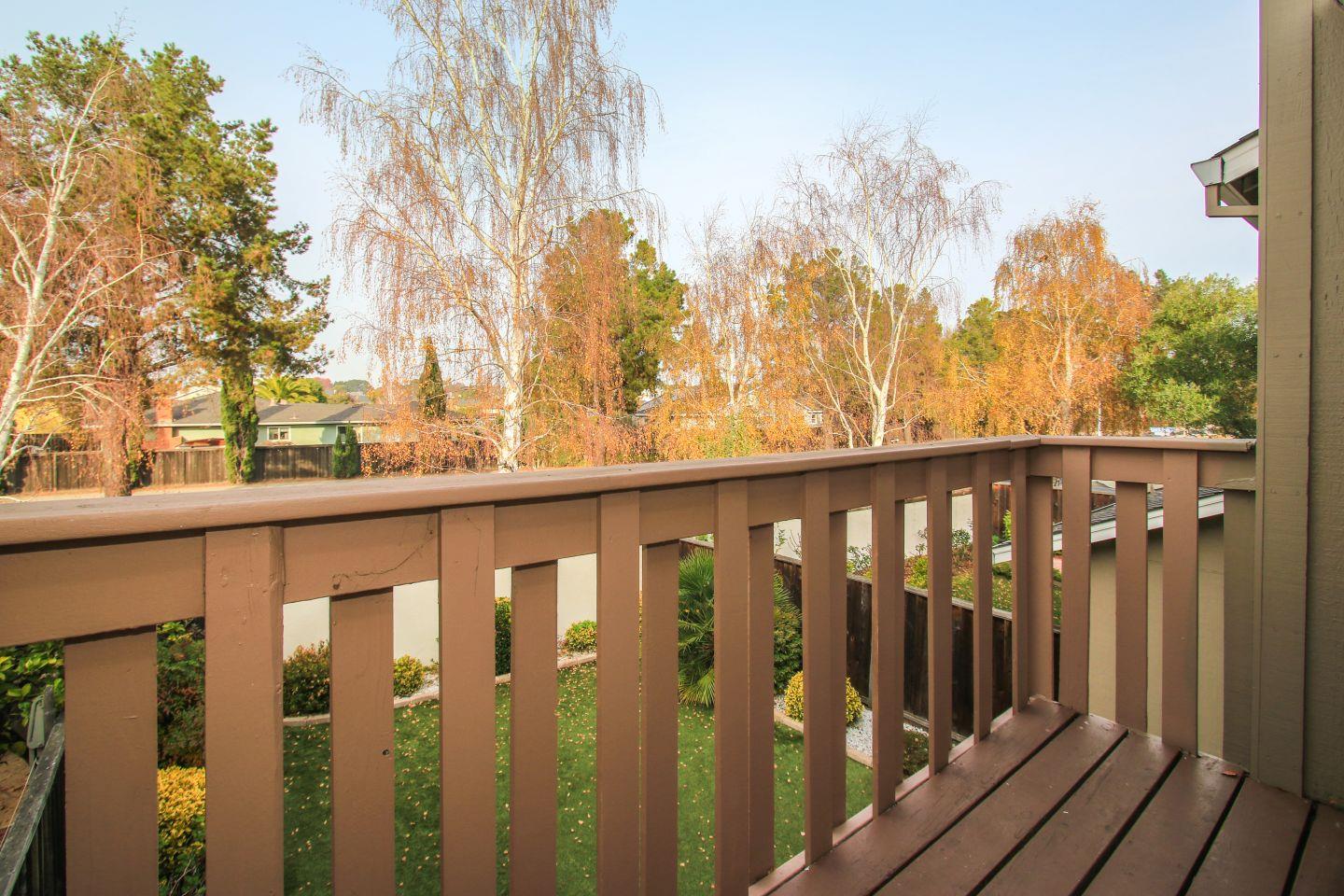 837 Spruance Lane Foster City, CA 94404 - Photo 25 of 32 a view of a balcony with wooden fence