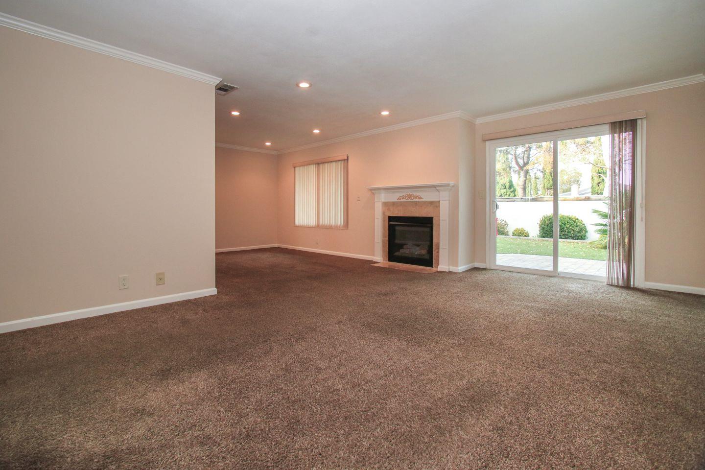 837 Spruance Lane Foster City, CA 94404 - Photo 4 of 32 a view of empty room with a fireplace and window