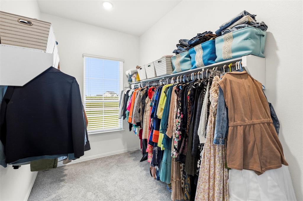 107 Yampa Court Rhome, TX 76078 - Photo 25 of 30 Walk-in closet with soft gray carpeting