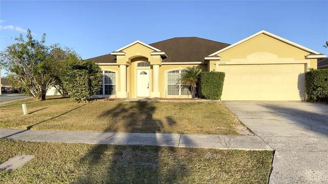 a view of garage and yard
