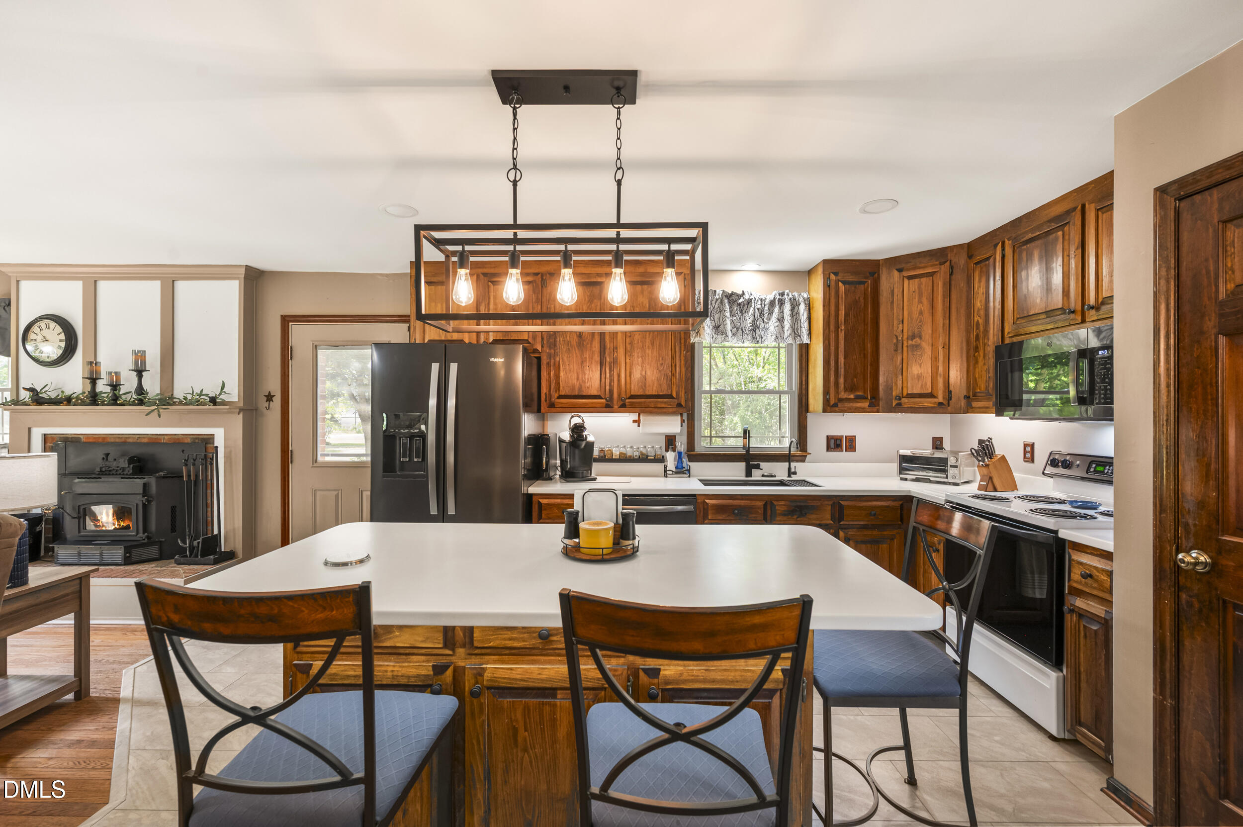 4209 Lassiter Road Wake Forest, NC 27587 - Photo 27 of 39 a kitchen with a dining table and chairs