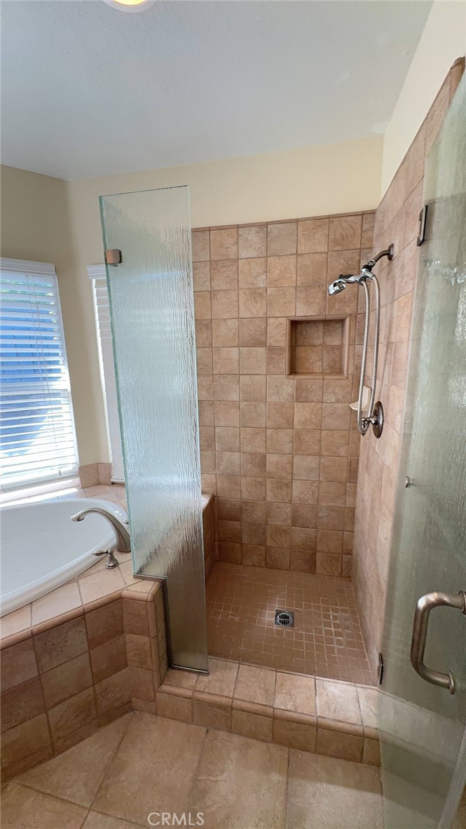 38265 Birch Court Murrieta, CA 92562 - Photo 17 of 46 a bathroom with a shower