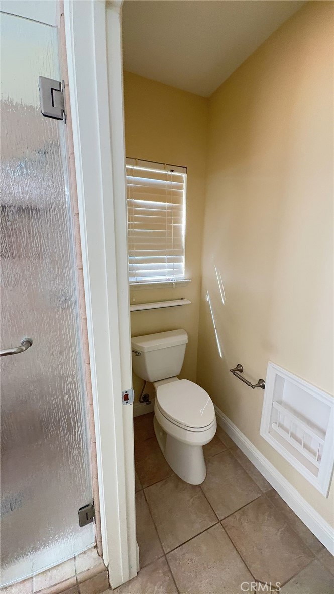 38265 Birch Court Murrieta, CA 92562 - Photo 18 of 46 a bathroom with a toilet and a shower
