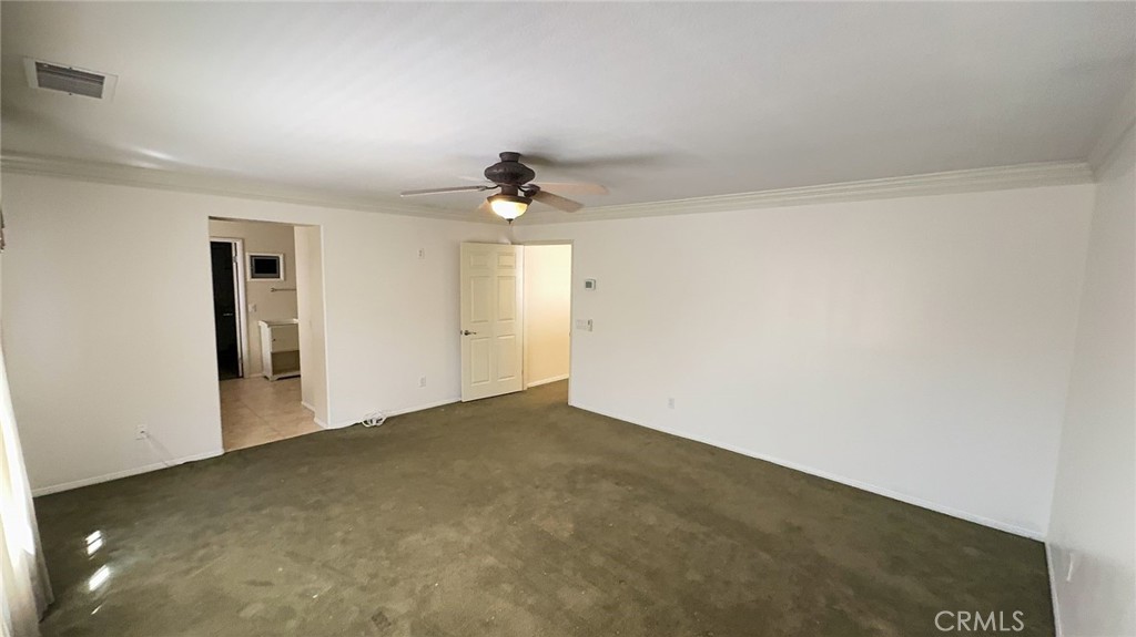 38265 Birch Court Murrieta, CA 92562 - Photo 20 of 46 an empty room with a ceiling fan and carpet