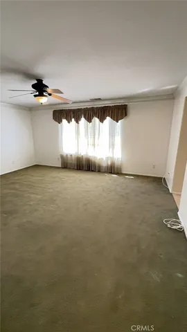 a view of an empty room and window