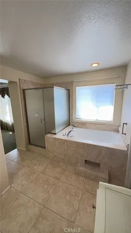 a bathroom with a bathtub and a sink