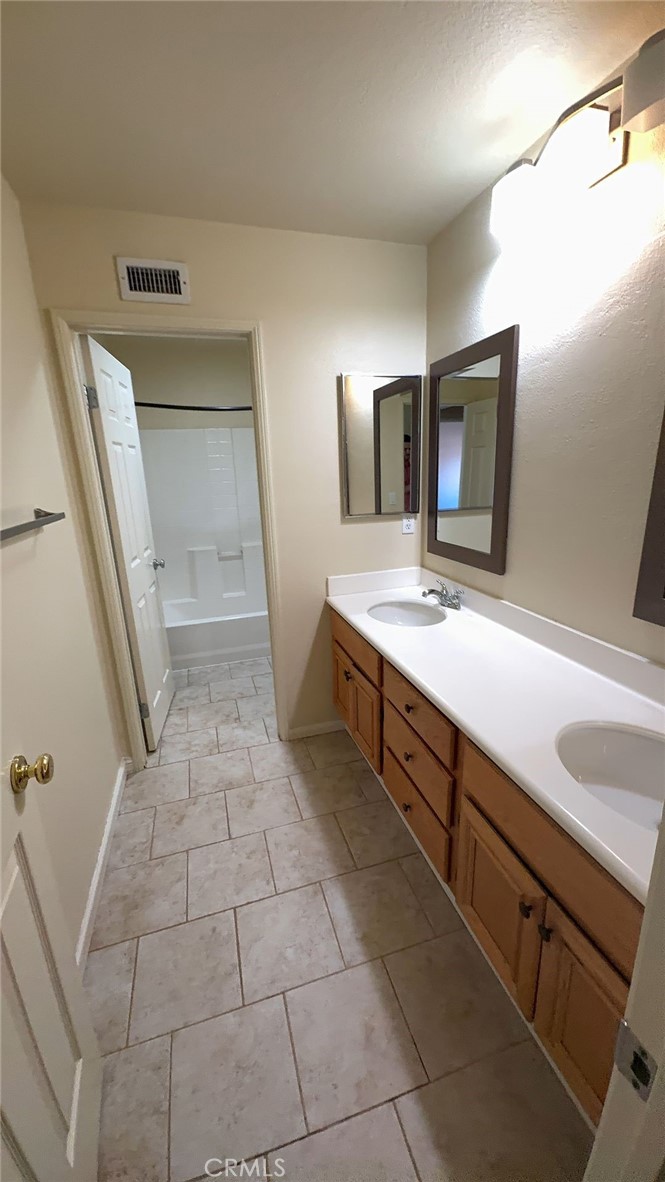38265 Birch Court Murrieta, CA 92562 - Photo 32 of 46 a bathroom with a sink a toilet and mirror