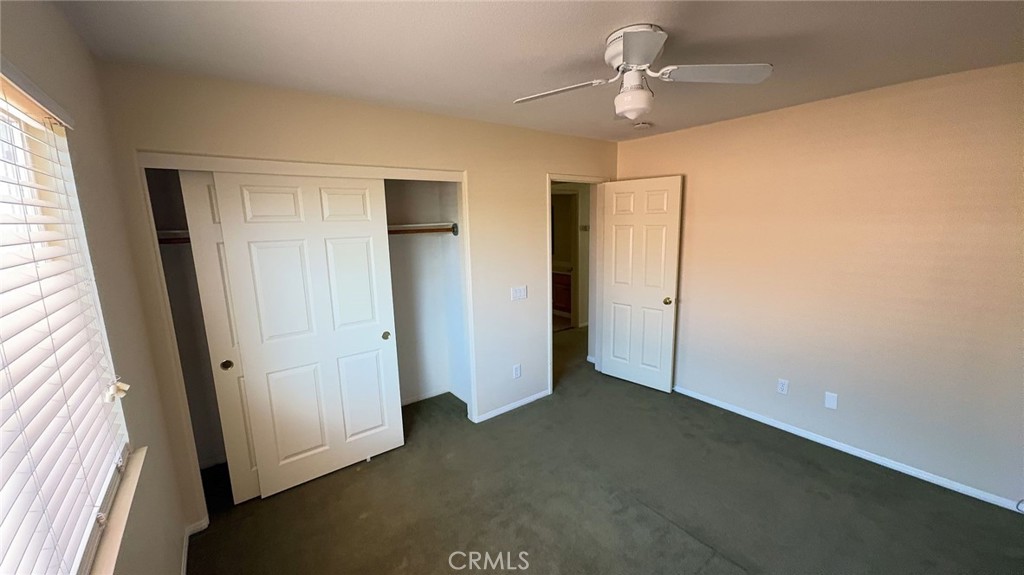 38265 Birch Court Murrieta, CA 92562 - Photo 35 of 46 an empty room with windows and fan