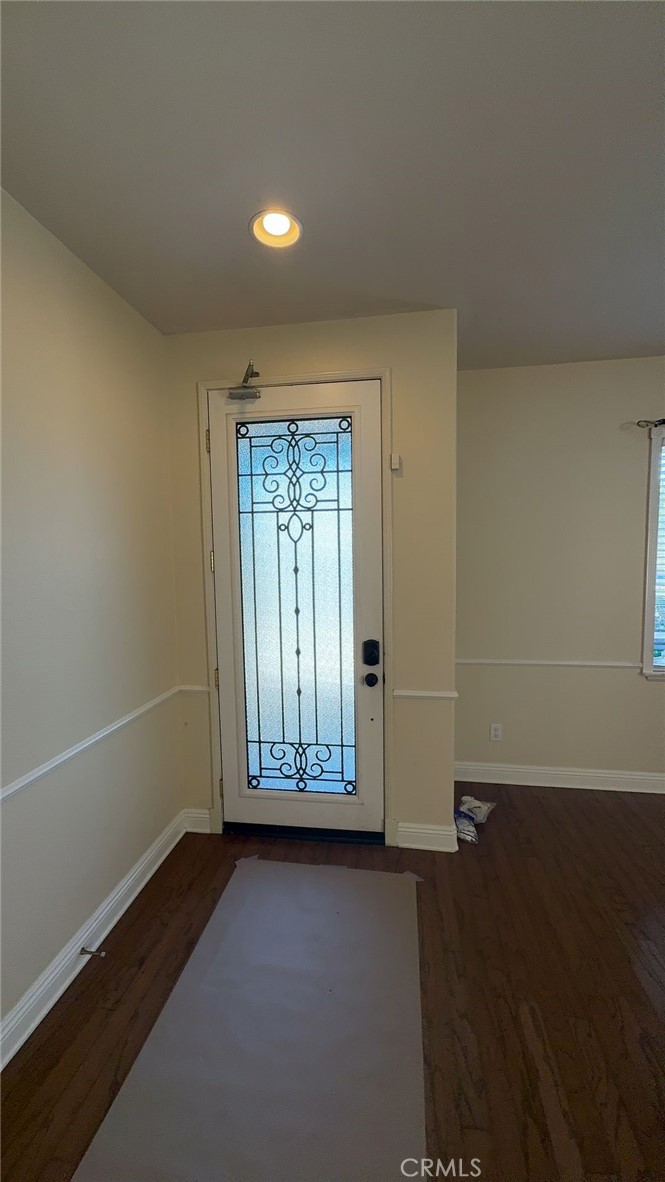 38265 Birch Court Murrieta, CA 92562 - Photo 4 of 46 an empty room with wooden floor and windows