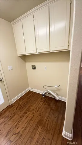a view of a patio with table and chairs potted plants with wooden floor and fence