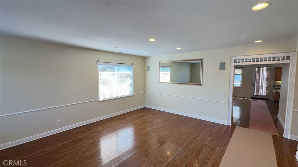 38265 Birch Court Murrieta, CA 92562 - Photo 8 of 46 a view of empty room with wooden floor and fan