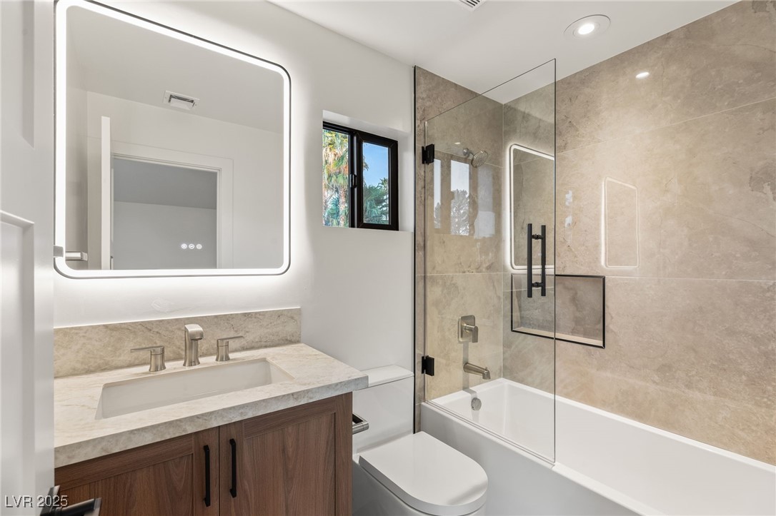2316 Prometheus Court Henderson, NV 89074 - Photo 47 of 92 Full bathroom with toilet, enclosed tub / shower combo, vanity, and visible vents