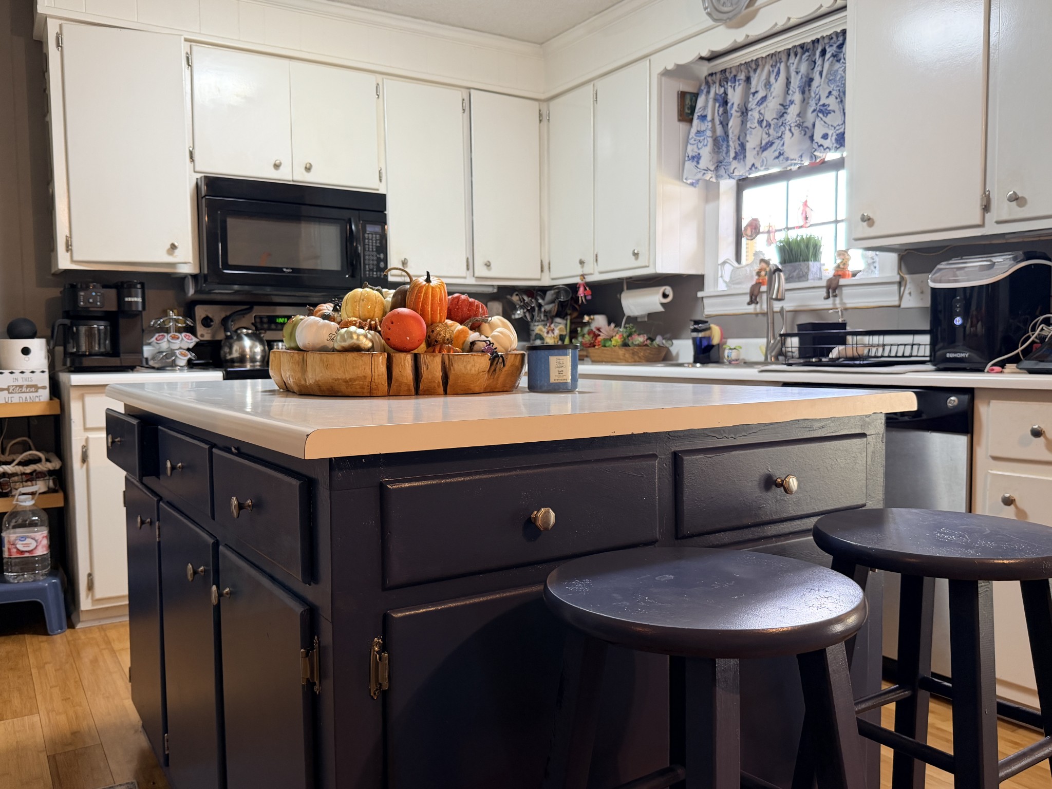2890 Nance Bend Road Clifton, TN 38425 - Photo 14 of 52 a kitchen with stainless steel appliances a sink a stove a table and chairs
