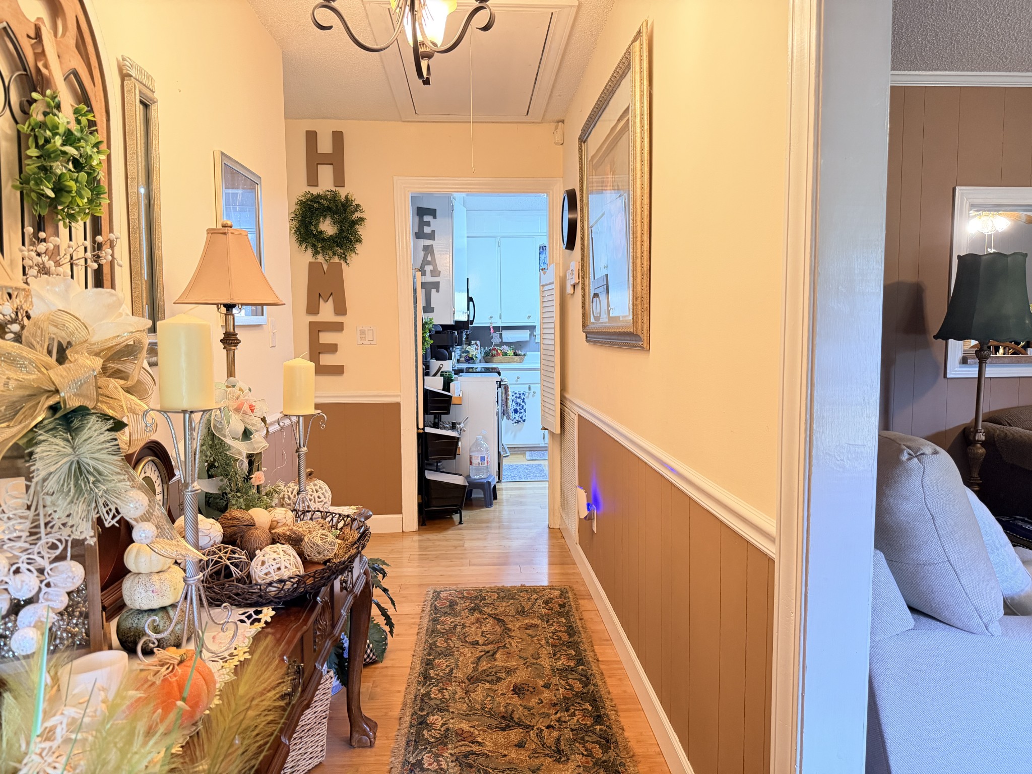 2890 Nance Bend Road Clifton, TN 38425 - Photo 20 of 52 a hallway with painting on the wall and a large mirror