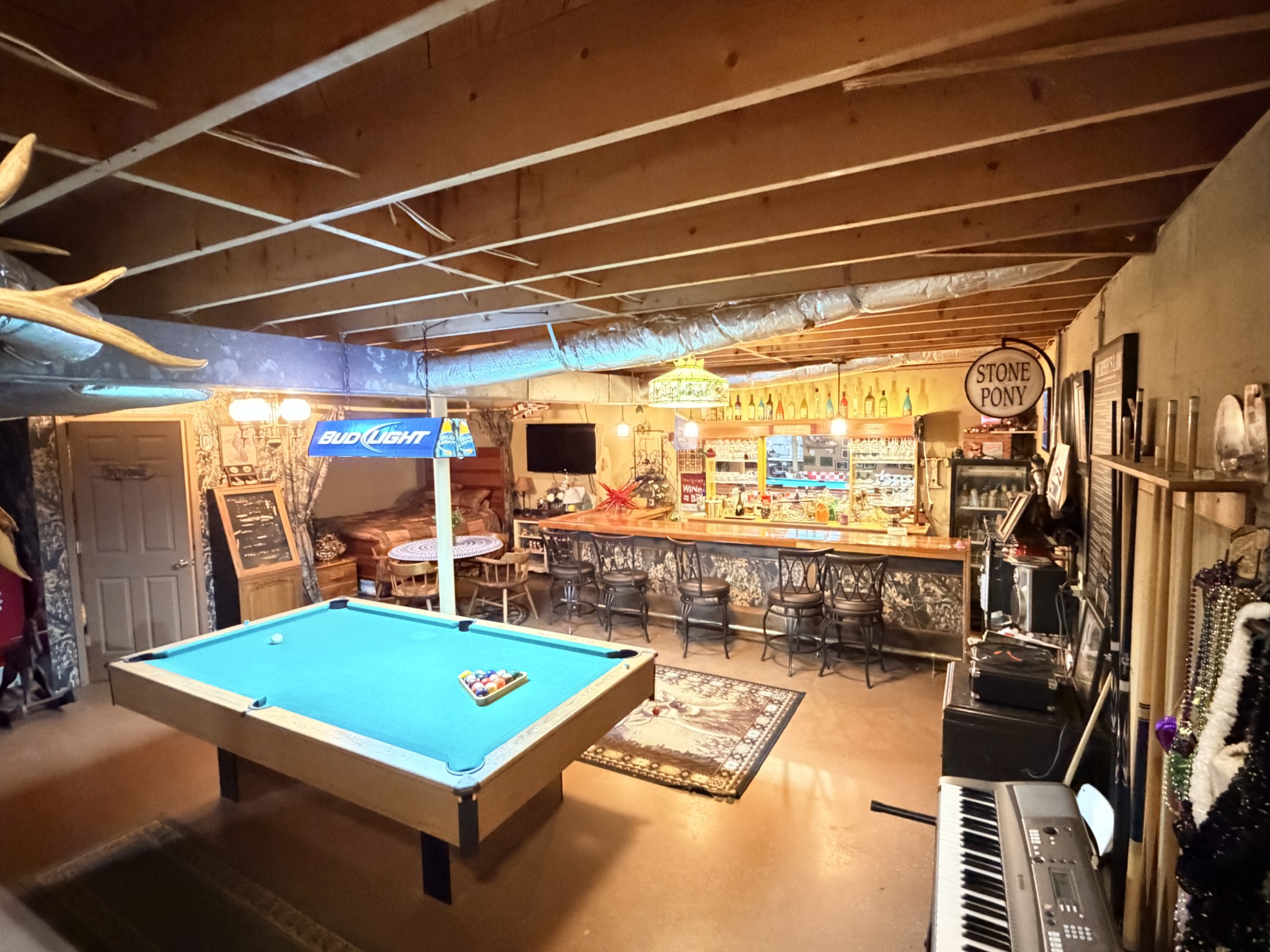 2890 Nance Bend Road Clifton, TN 38425 - Photo 31 of 52 a room with pool table a flat screen tv and view of living room