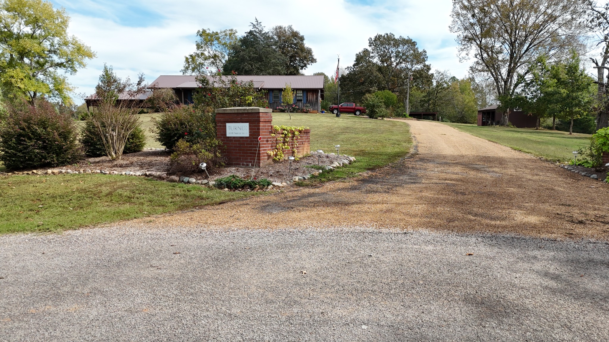 2890 Nance Bend Road Clifton, TN 38425 - Photo 50 of 52 a front view of a house with a yard and garage