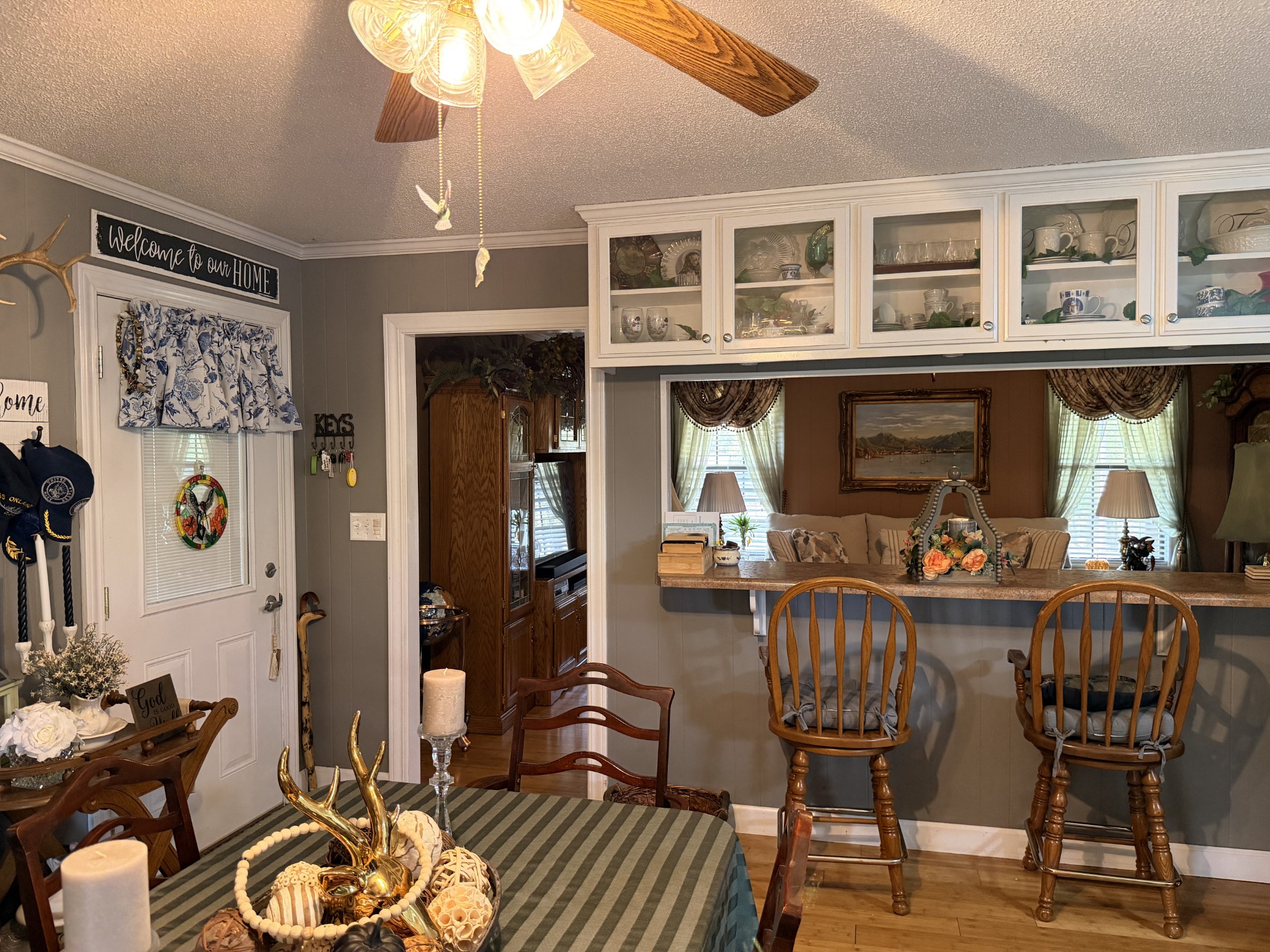 2890 Nance Bend Road Clifton, TN 38425 - Photo 10 of 52 a view of a dining room with furniture and chandelier