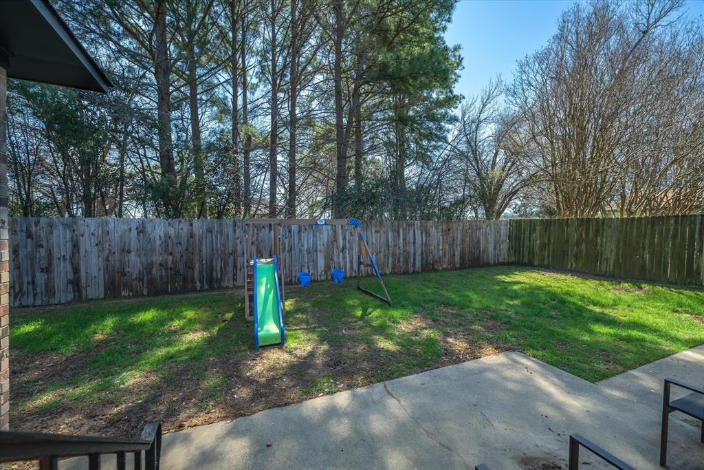 1460 Forrest Drive Canton, TX 75103 - Photo 30 of 36 a backyard of a house with lots of green space