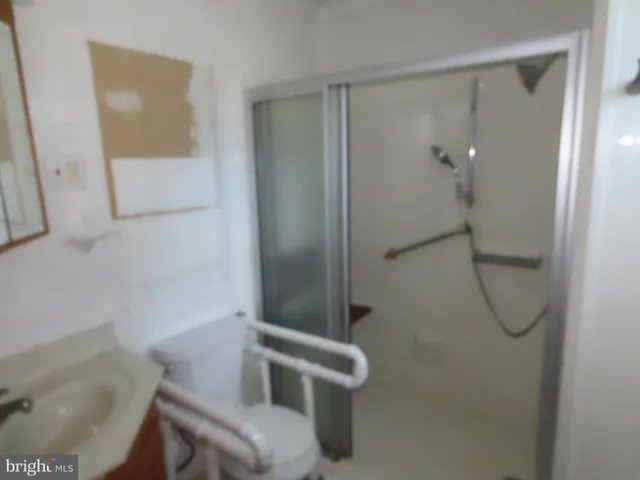 a bathroom with a shower and toilet
