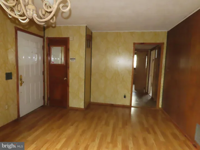 a view of hallway with wooden floor