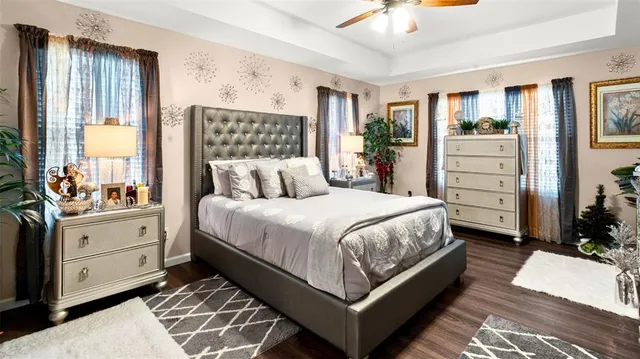a bedroom with a large bed and a dresser