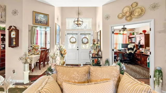 a living room with fireplace furniture and decor
