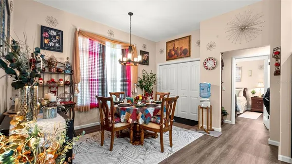 a view of a dining room with furniture and window