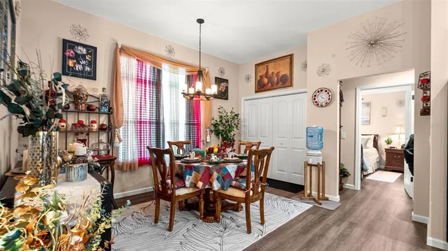 a view of a dining room with furniture and window