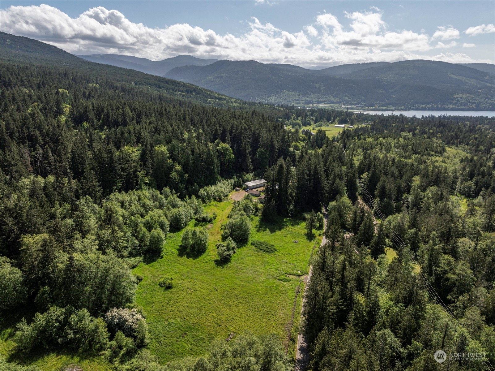 1434 Chicken Coop Road Sequim, WA 98382 - Photo 18 of 25 a view of a garden with mountains