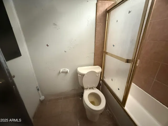 a bathroom with a toilet and a sink