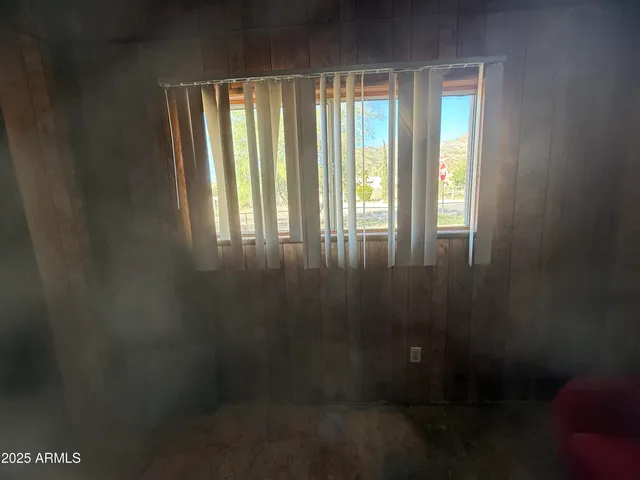 a living room with furniture window and flat screen tv