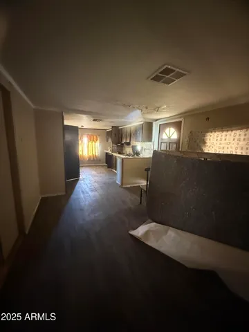 a kitchen with a sink appliances and cabinets