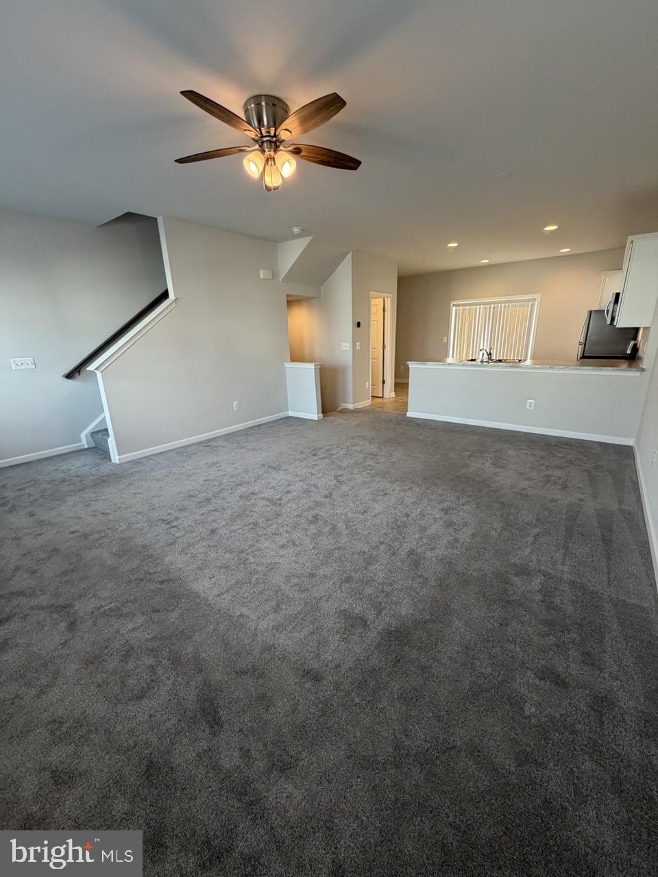 146 Galaxy Place Stephenson, VA 22656 - Photo 23 of 46 a view of a livingroom with a ceiling fan and window