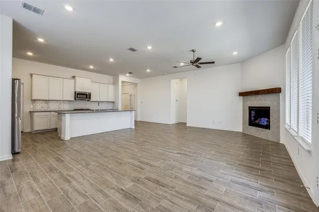 a view of a kitchen with a sink and a stove top oven