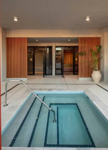 a view of swimming pool with seating space