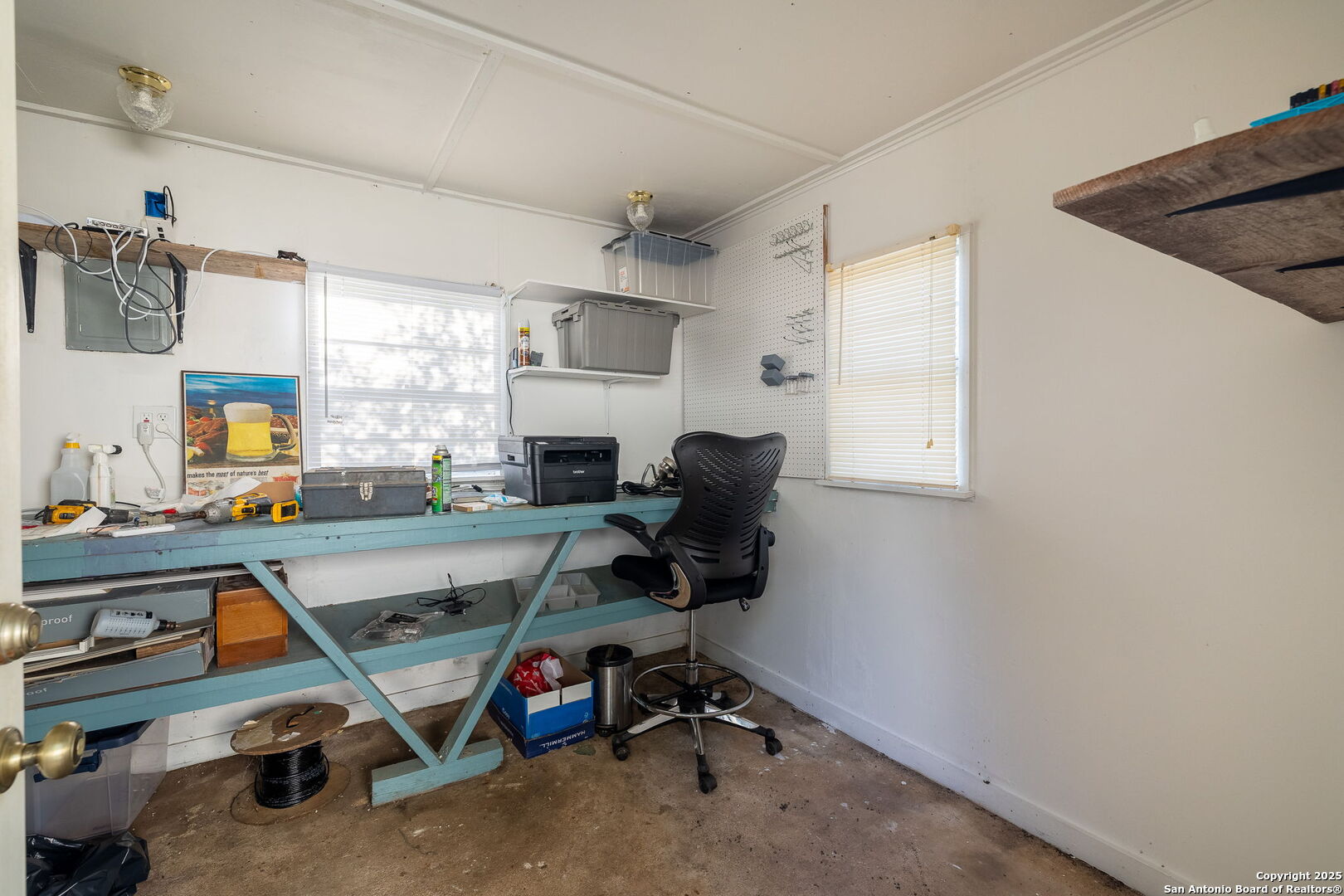 1060 Forest View Drive Blanco, TX 78606 - Photo 19 of 24 a view of a workspace with furniture and a window
