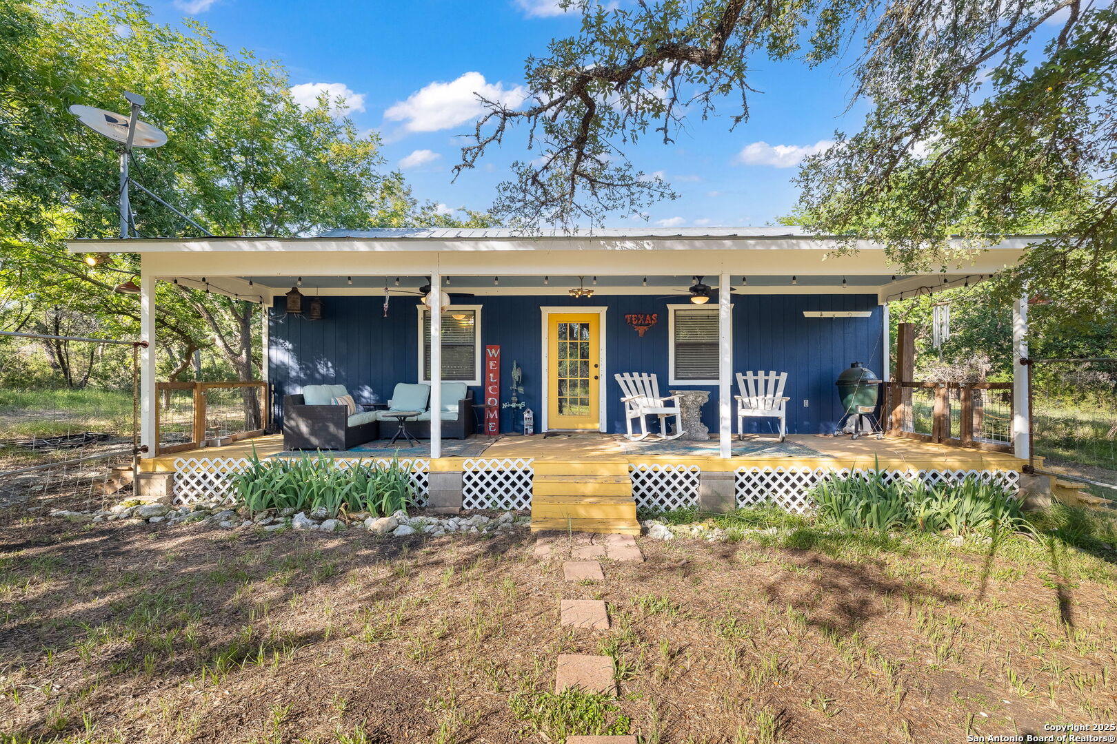1060 Forest View Drive Blanco, TX 78606 - Photo 4 of 24 a view of a house with backyard porch and sitting area