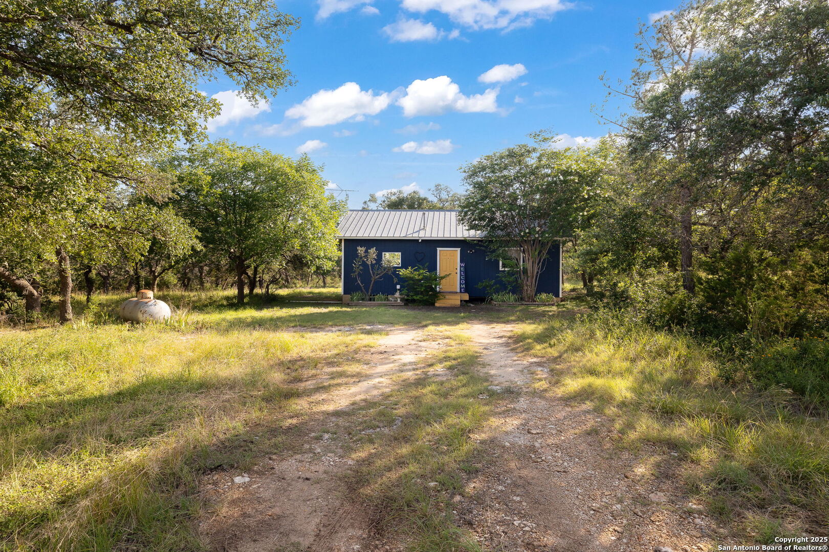 1060 Forest View Drive Blanco, TX 78606 - Photo 8 of 24 a front view of a house with a yard