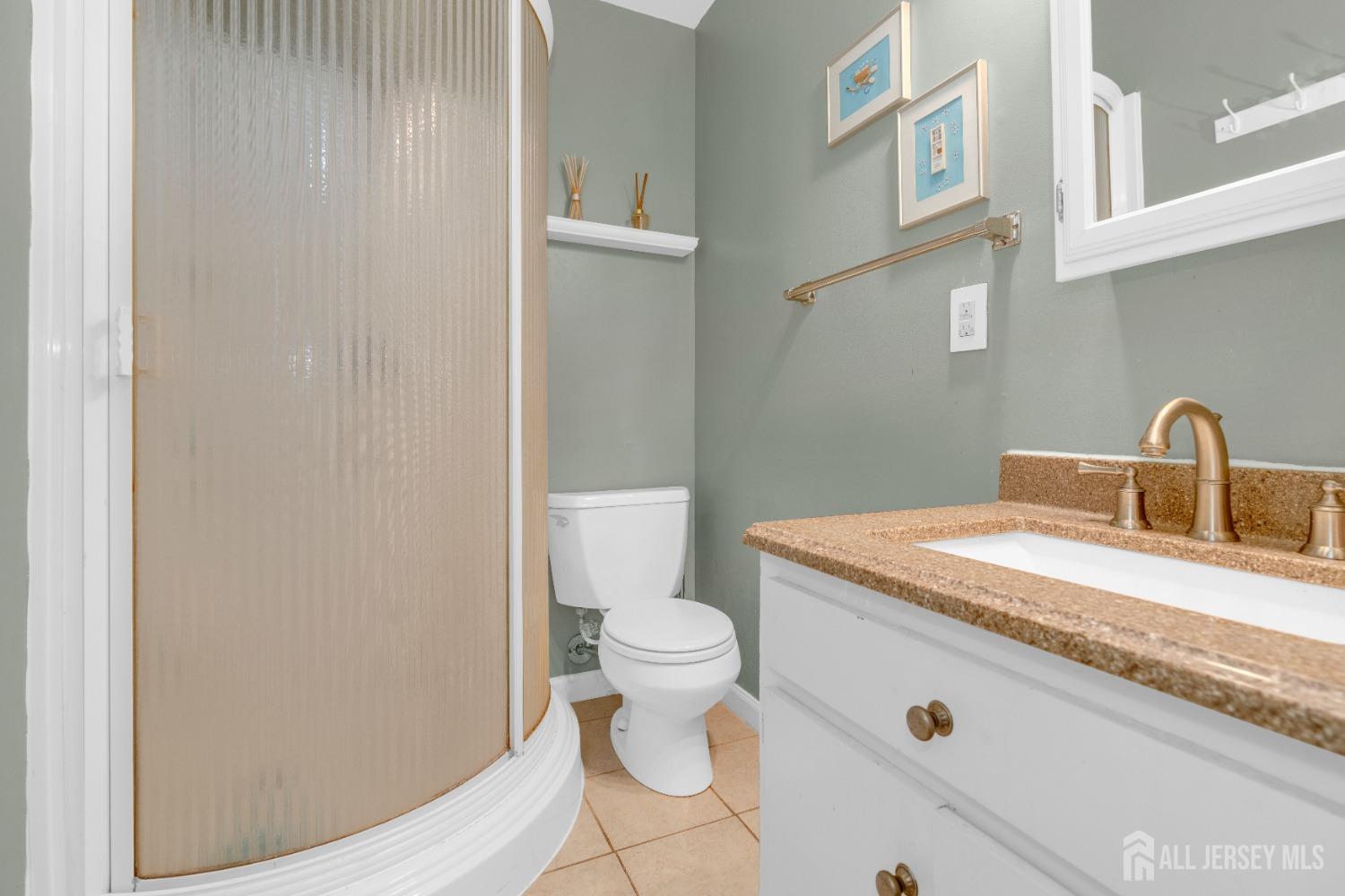 90 Pheasant Run Edison, NJ 08820 - Photo 24 of 39 a bathroom with a sink and a toilet