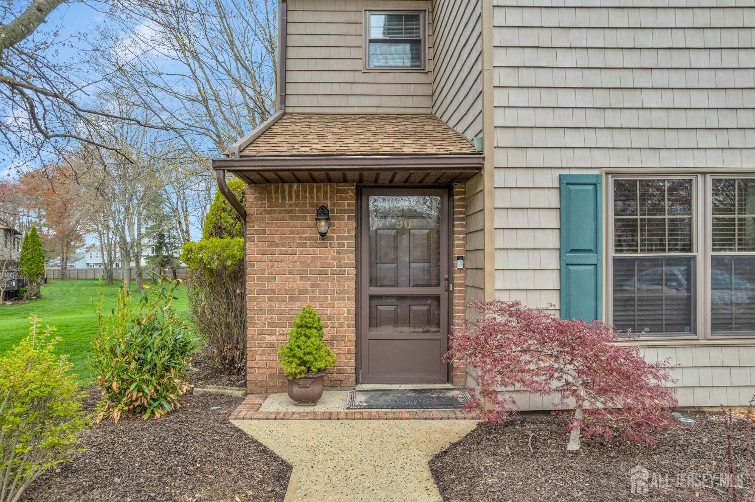 90 Pheasant Run Edison, NJ 08820 - Photo 3 of 39 a front view of a house with garden