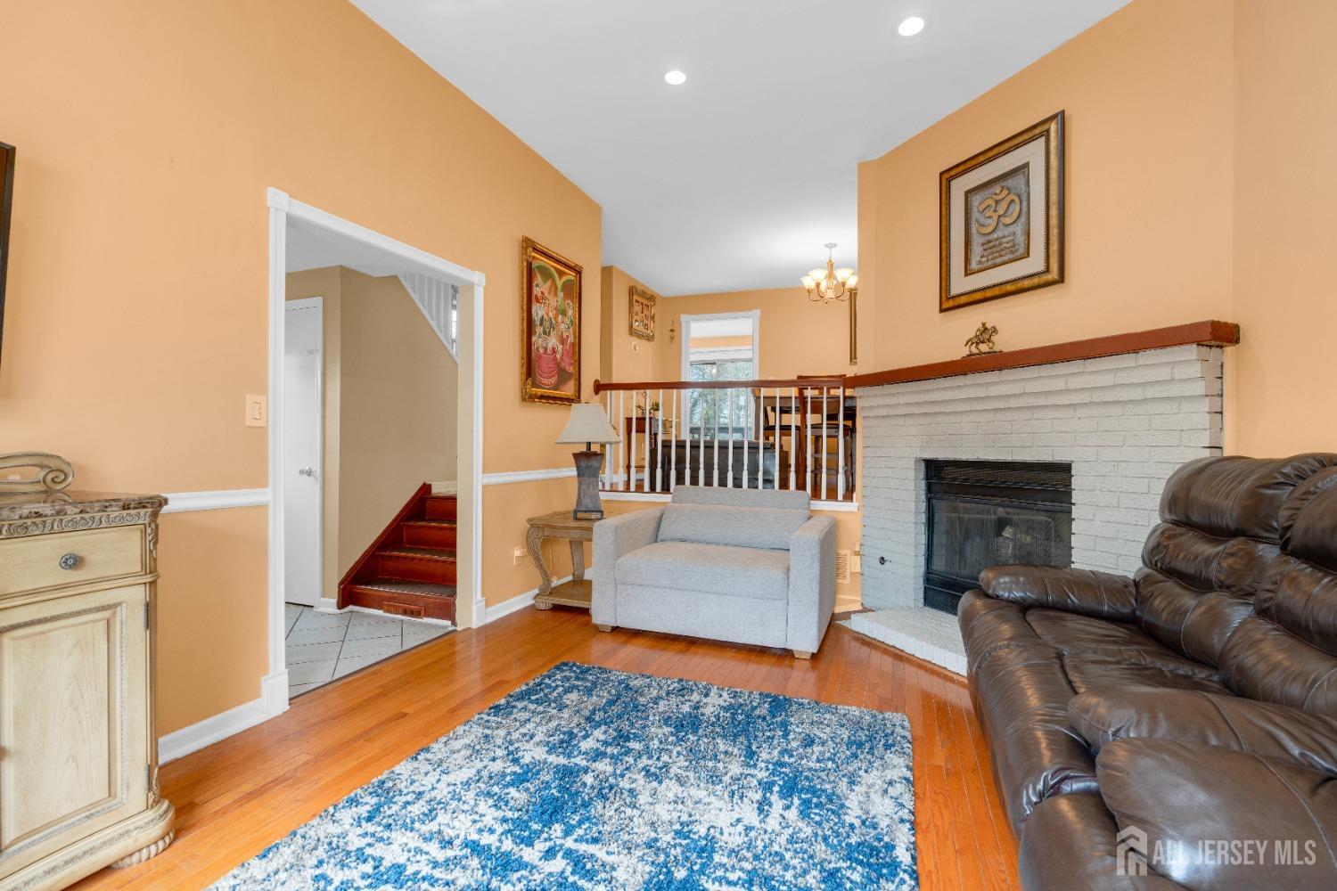 90 Pheasant Run Edison, NJ 08820 - Photo 5 of 39 a living room with furniture and a fireplace