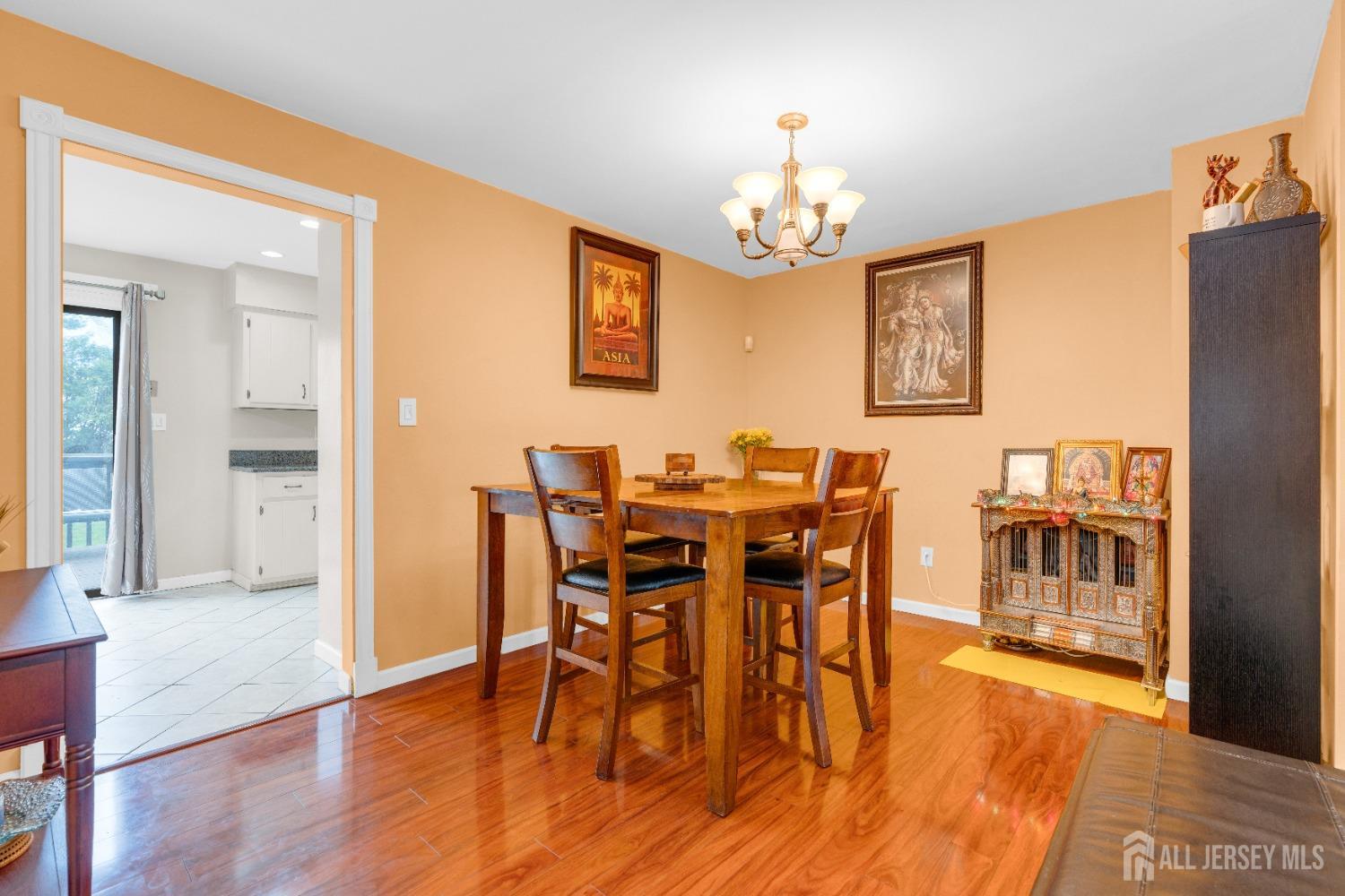90 Pheasant Run Edison, NJ 08820 - Photo 7 of 39 a view of a dining room with furniture and chandelier