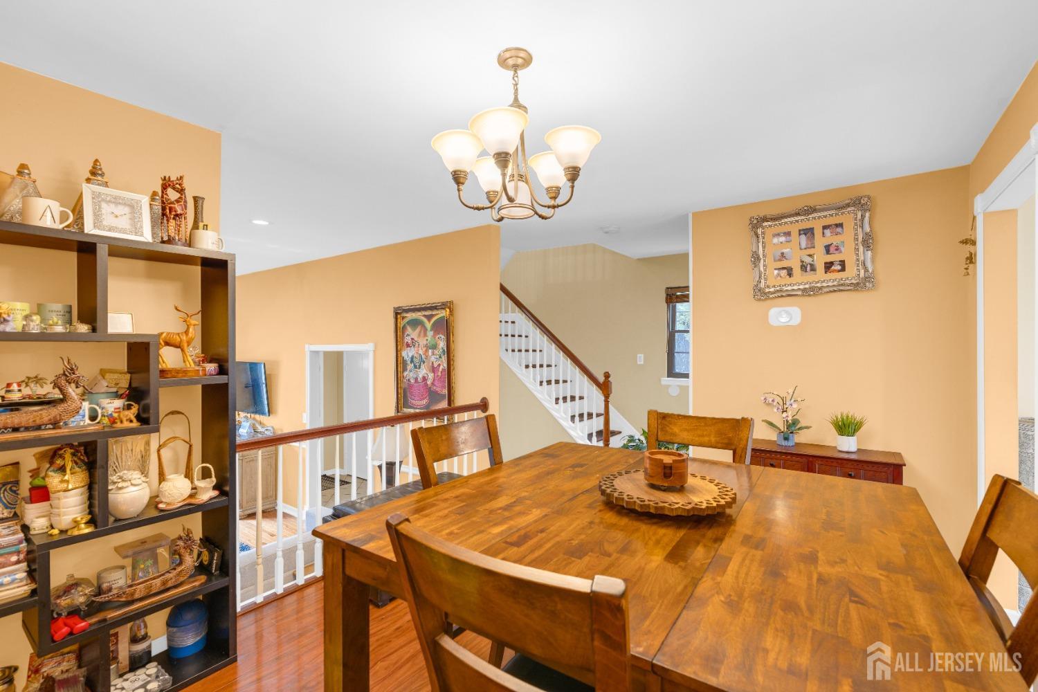 90 Pheasant Run Edison, NJ 08820 - Photo 8 of 39 a view of a dining room with furniture and a chandelier