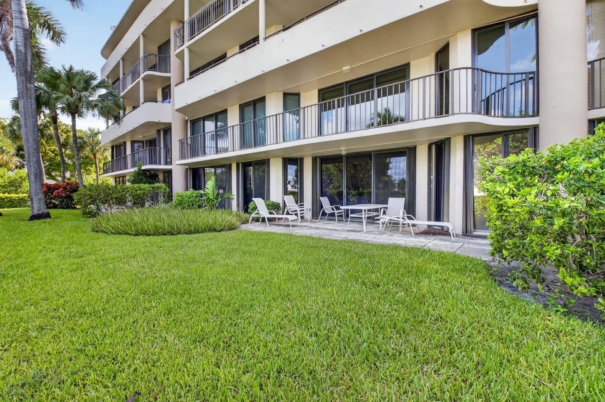 1401 South Ocean Boulevard, Unit 1060 Boca Raton, FL 33432 - Photo 26 of 46 a front view of building with yard