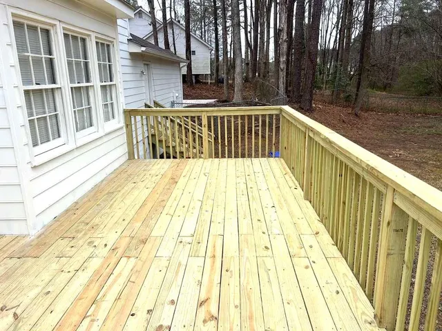a view of balcony with wooden floor and outdoor space