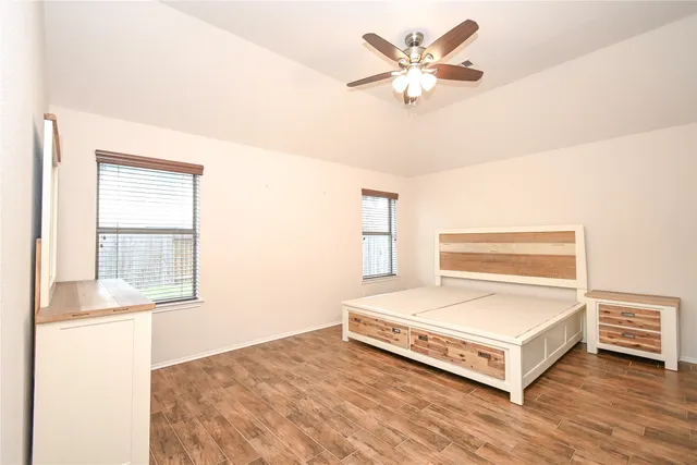 a living room with a bed furniture and a window