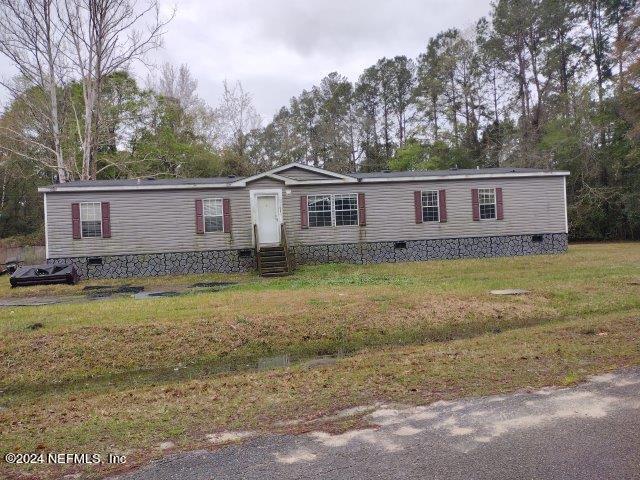 54536 Hurst Road Callahan, FL 32011 - Photo 1 of 1 a view of a house with a yard