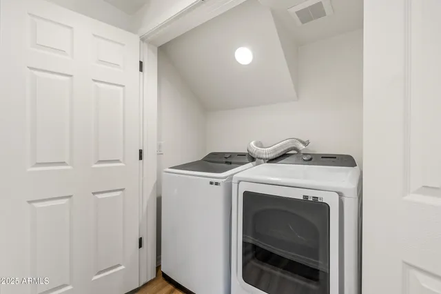 a bathroom with a sink a mirror and a toilet