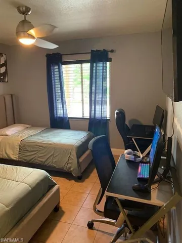 a view of a dining room with furniture and a window