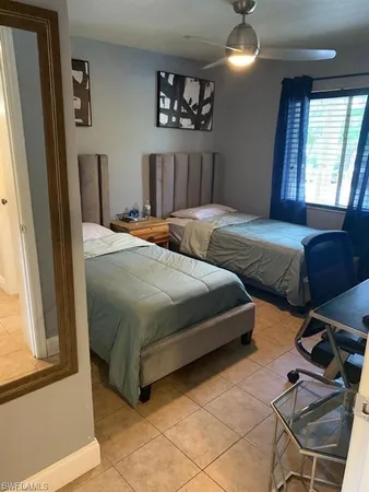 a bedroom with double bed and a window